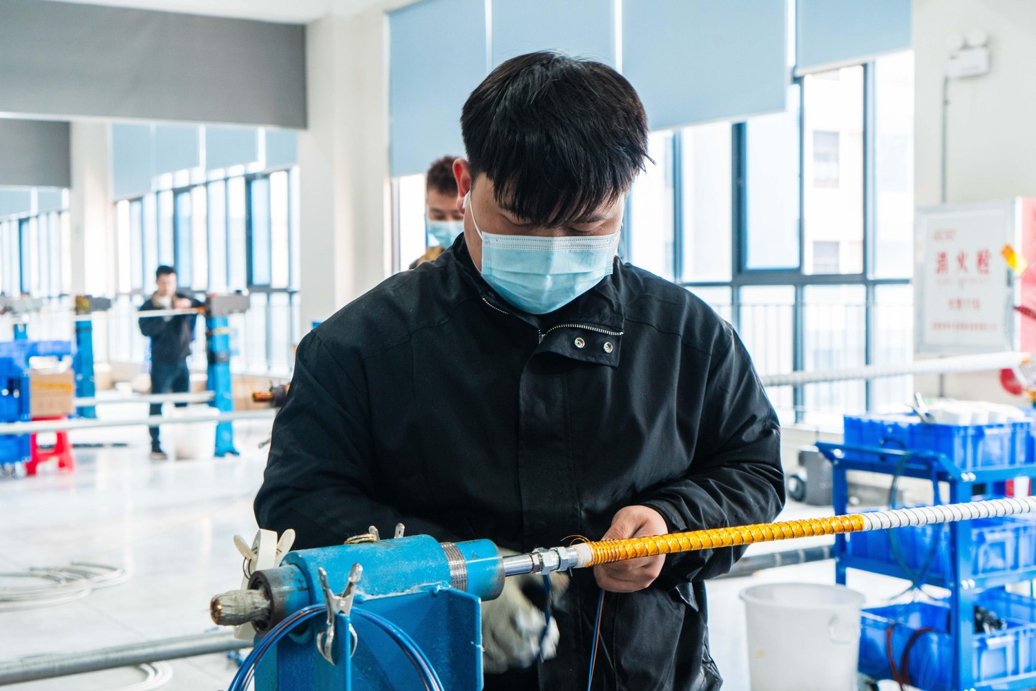 Hands-on assembly work at the production bench.
